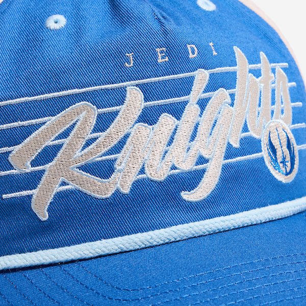 A close up of a blue and white hat featuring the words "Jedi Knights" prominently displayed on the front