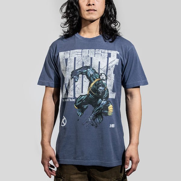 Man in a blue t-shirt featuring a faded graphic of Beast from X-Men