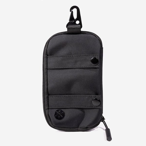 A compact, black zippered pouch with a hook clip at the top. The pouch features a metal decal at the bottom with the "Heroes and Villains" logo. The pouch has 2 strap horizontal across it with black button closures.