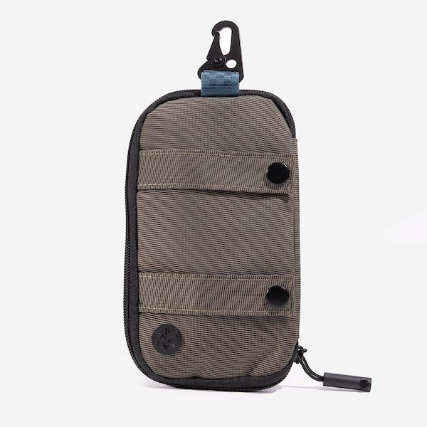 A compact, brown and blue zippered pouch with a hook clip at the top. The pouch features a metal decal at the bottom with the "Heroes and Villains" logo. The pouch has 2 strap horizontal across it with black button closures.