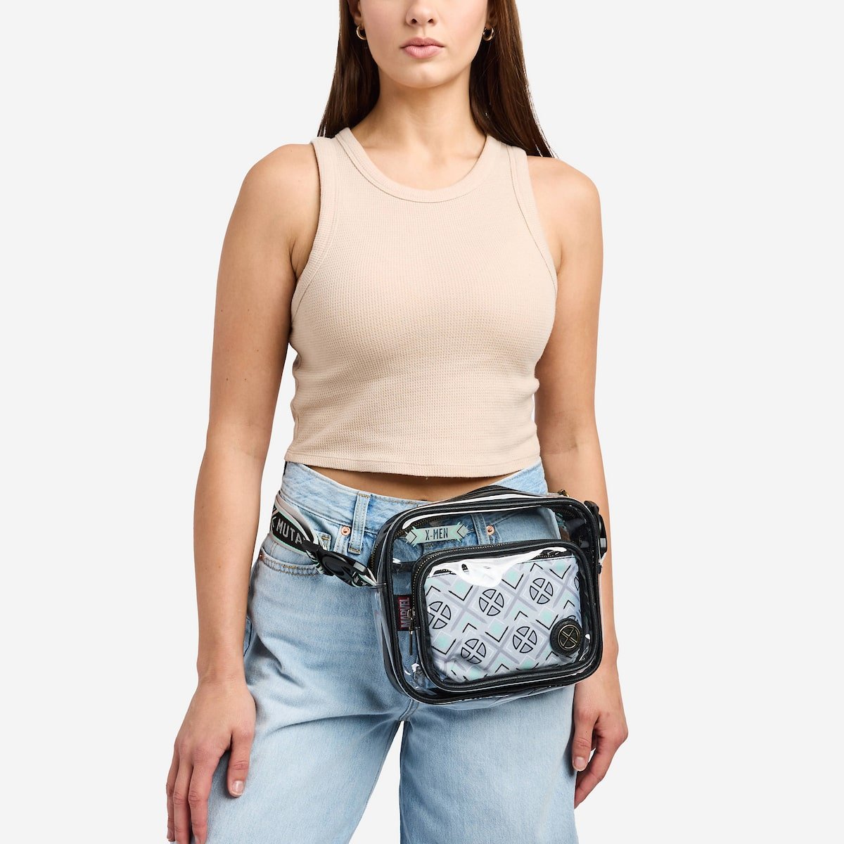 Woman wearing a transparent waist bag with visible x-men branding on a white background