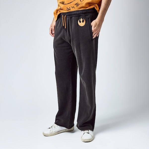 Close-up of embroidered Rebel Alliance insignia on joggers