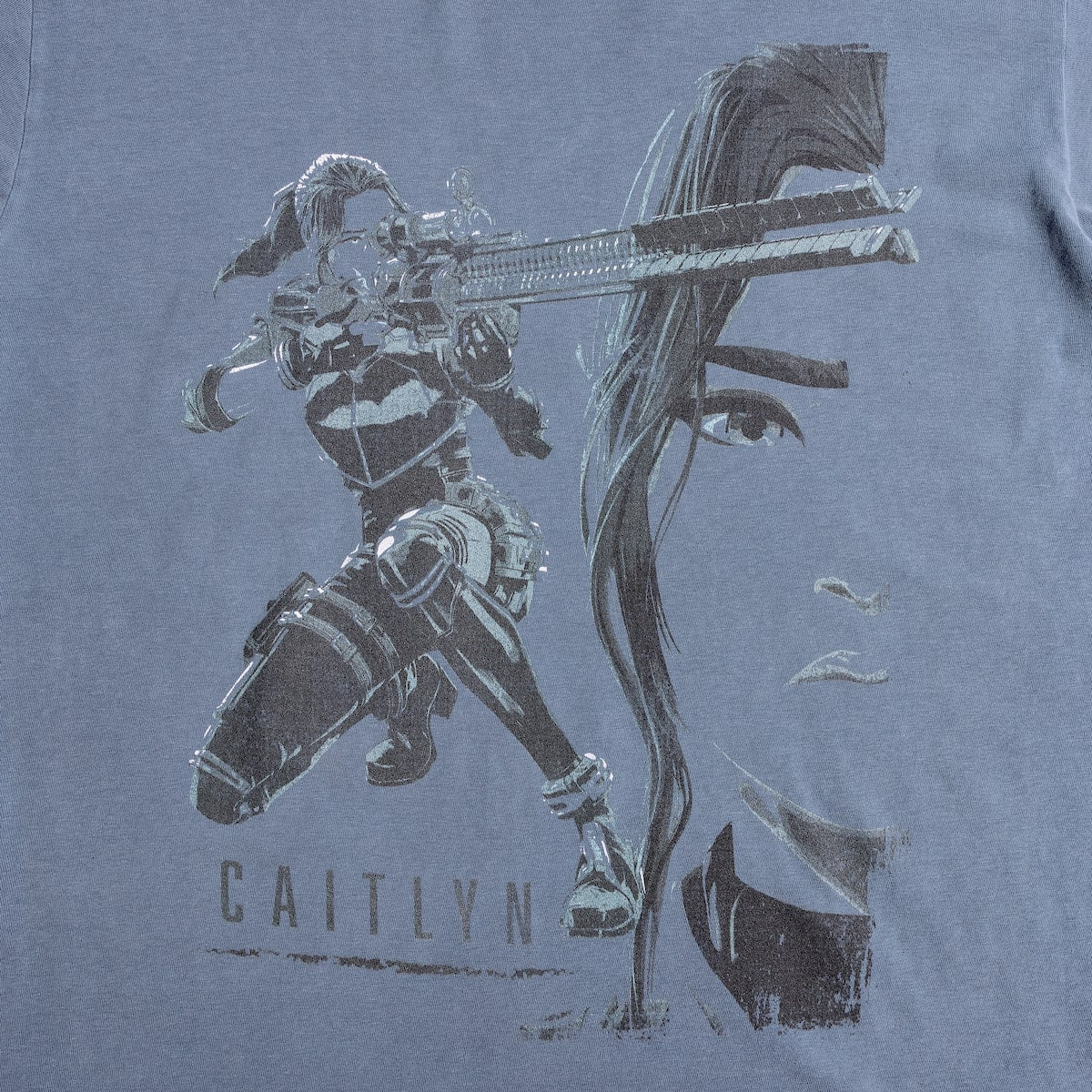 Dark Blue T-Shirt featuring a faded graphic of Caitlyn from Arcane
