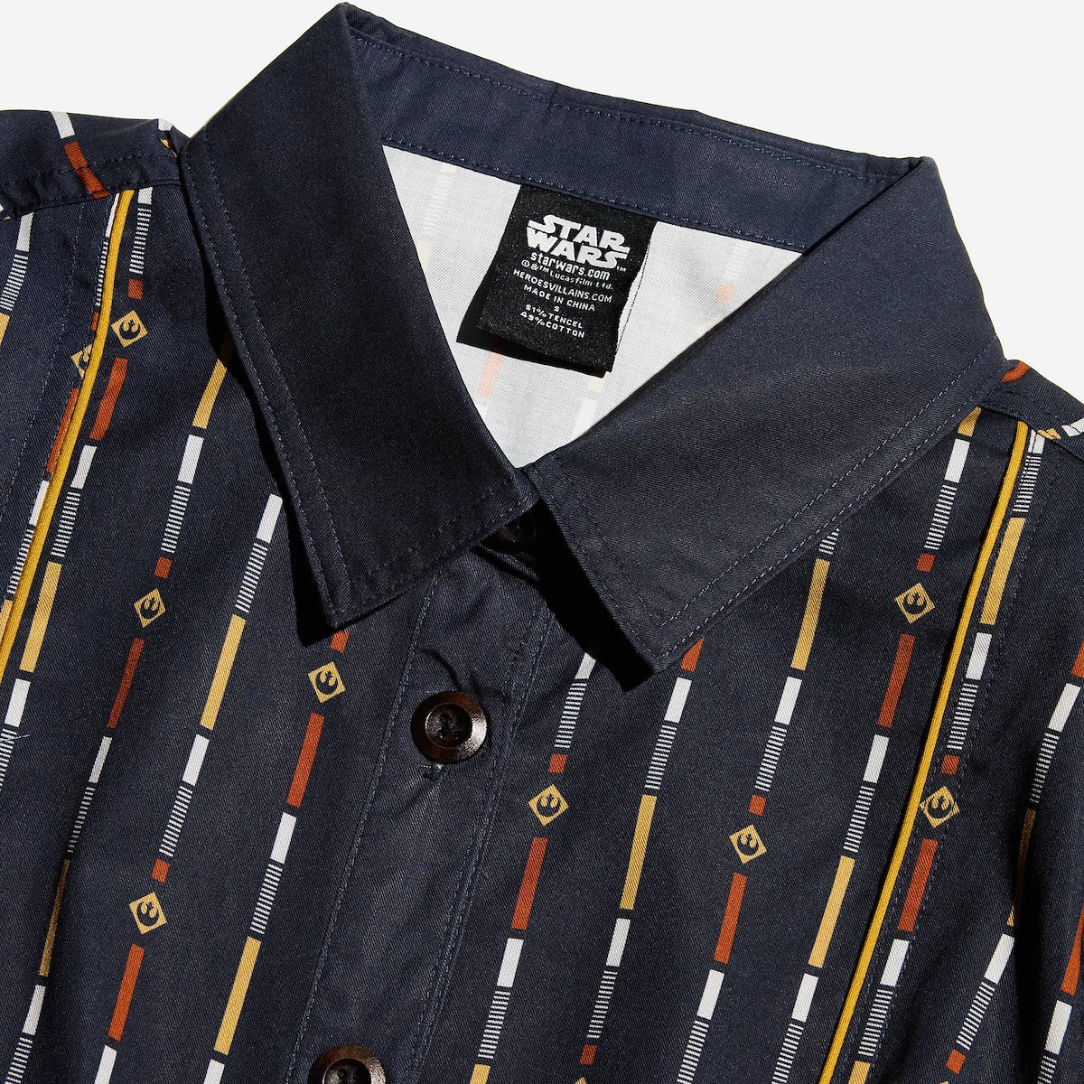 Close up of a button up navy dress thats star wars rebel inspired with a striped pattern