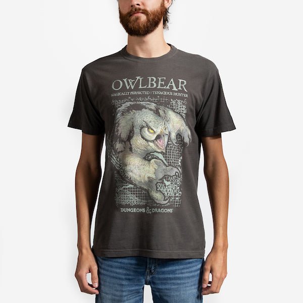 A man in a Brown T-Shirt featuring a photo of an "Owlbear" from Dungeons and Dragons