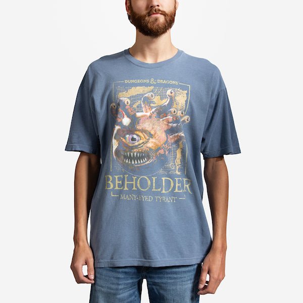 Man in a blue t-shirt. The t-shirt has a photo of a "Beholder" from Dungeons and Dragons