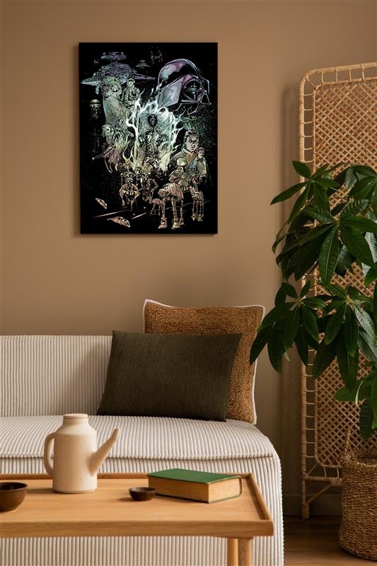 Living room with a star wars canvas on the wall, a couch, and a plant.