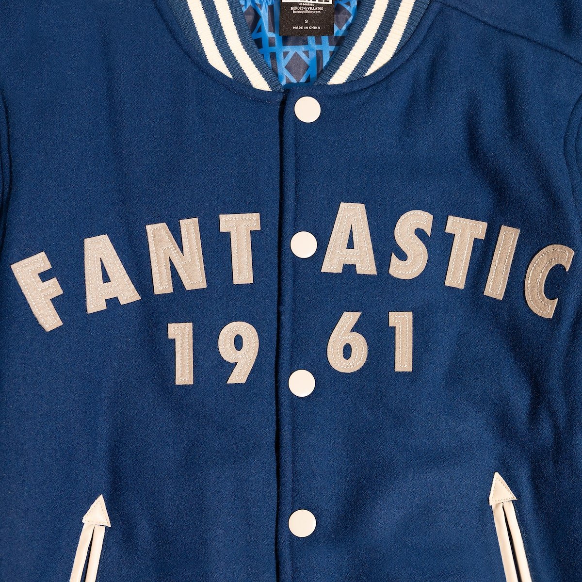 Blue Marvels Fantastic Four Varsity jacket with 'FANT•ASTIC 1961' text on a white background