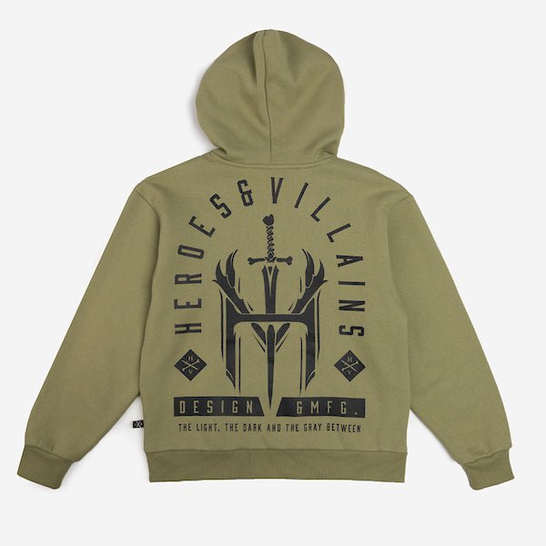 The picture shows the back of a green hoodie. The print on the back is in a tombstone shape and features a large logo of an "H" and "V" with a dagger going through. The words "Heroes & Villians" arch over the design in an arch shape.