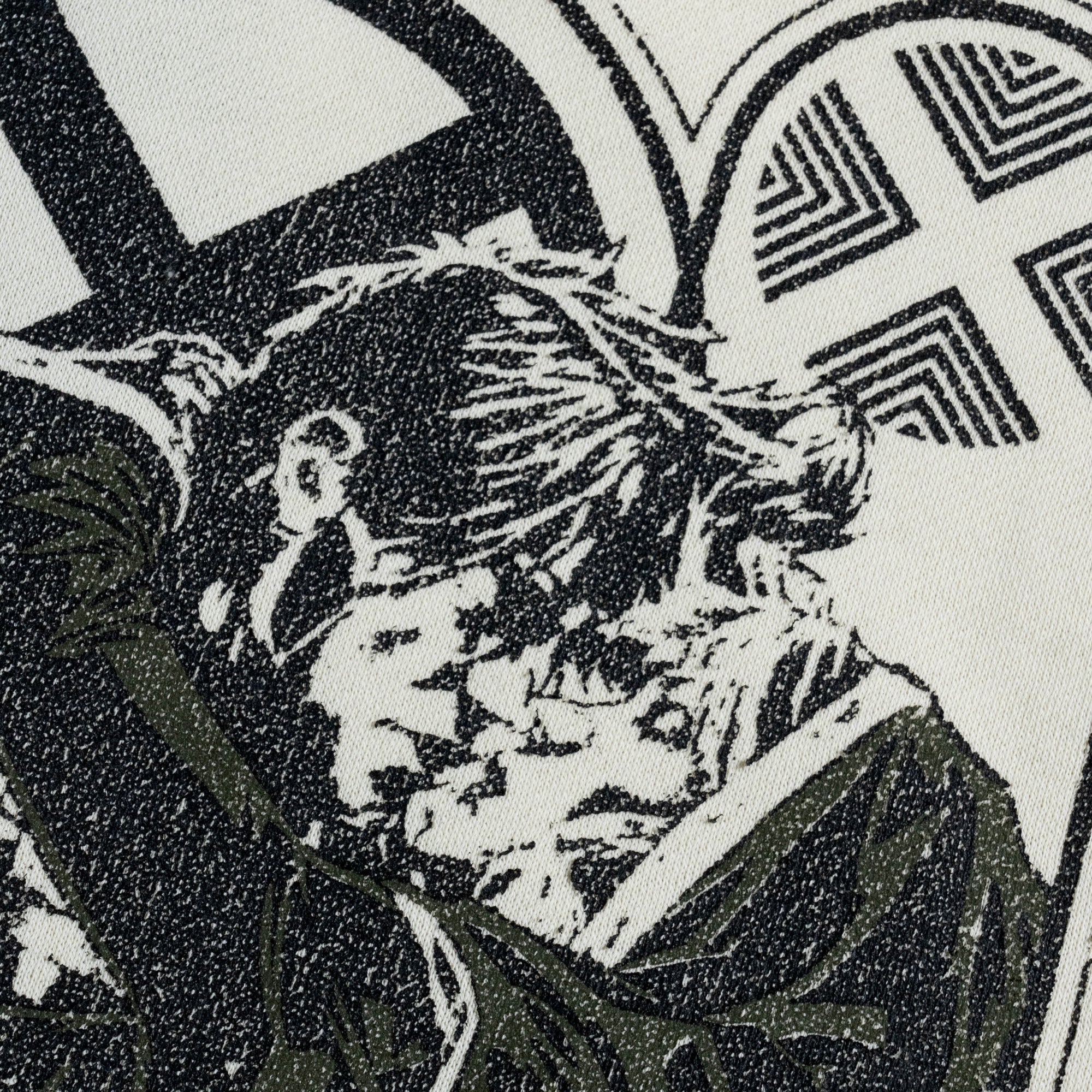 A dip-dyed hoodie in cream and green featuring X-Men's Rogue and Gambit. The front displays a small X-Men logo, while the back showcases a black-and-white comic-style illustration of Rogue and Gambit embracing, with the word "Sugah" below.