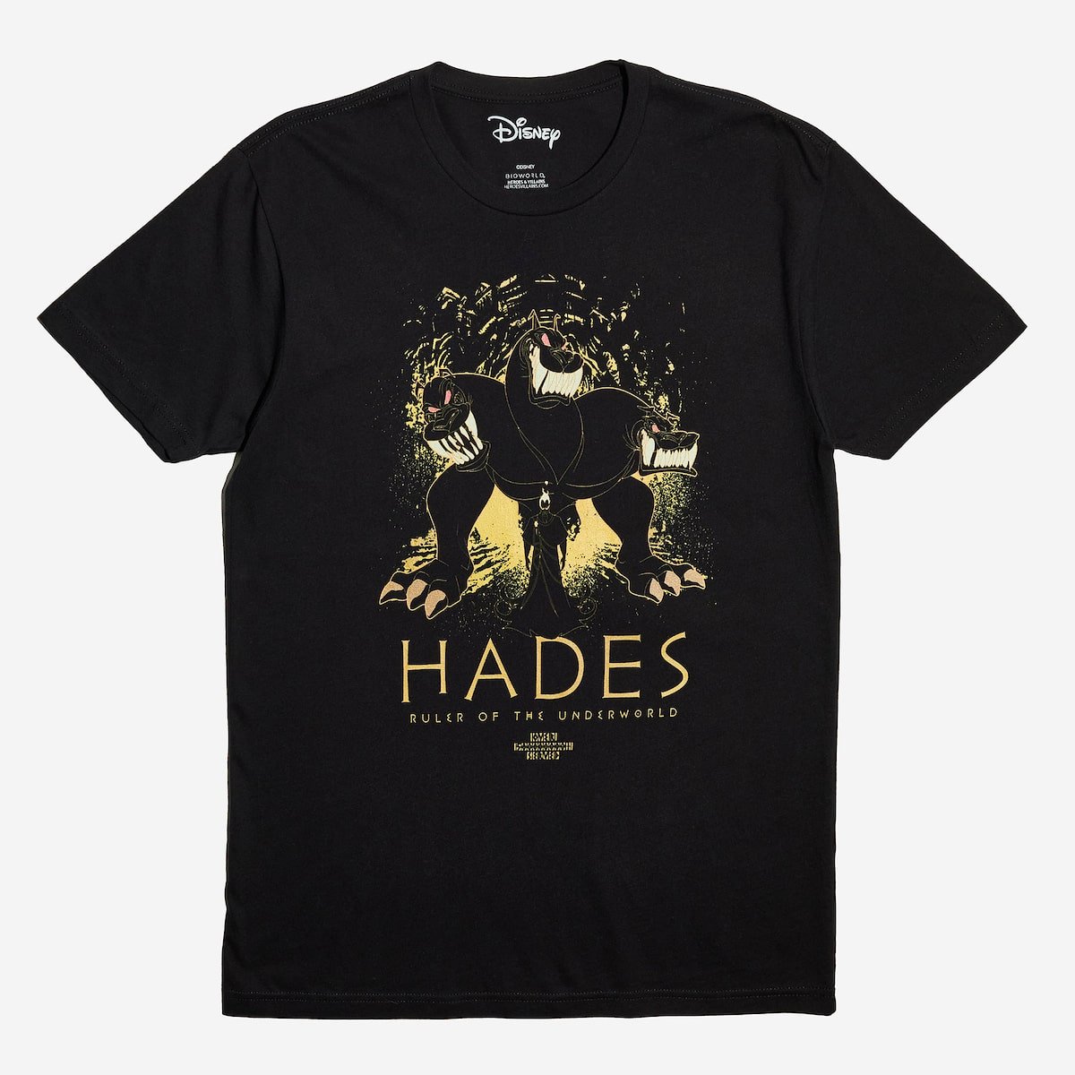 A black tee with an Illustration of a three-headed dog with a shadowy figure, hades, in front of it, set against an abstract background.