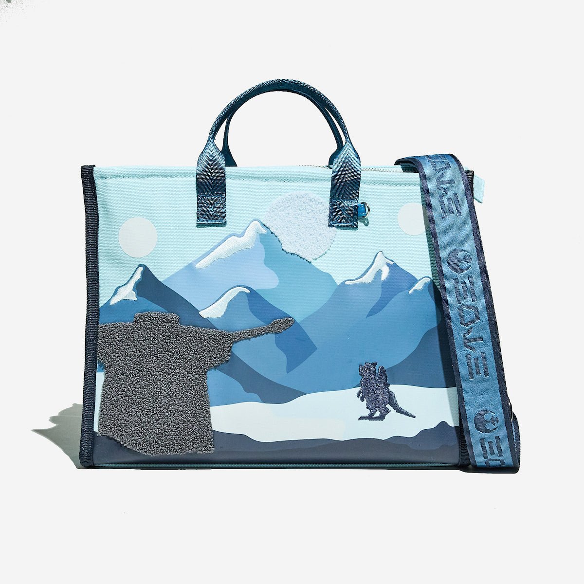 Tote bag with mountain design on a white background