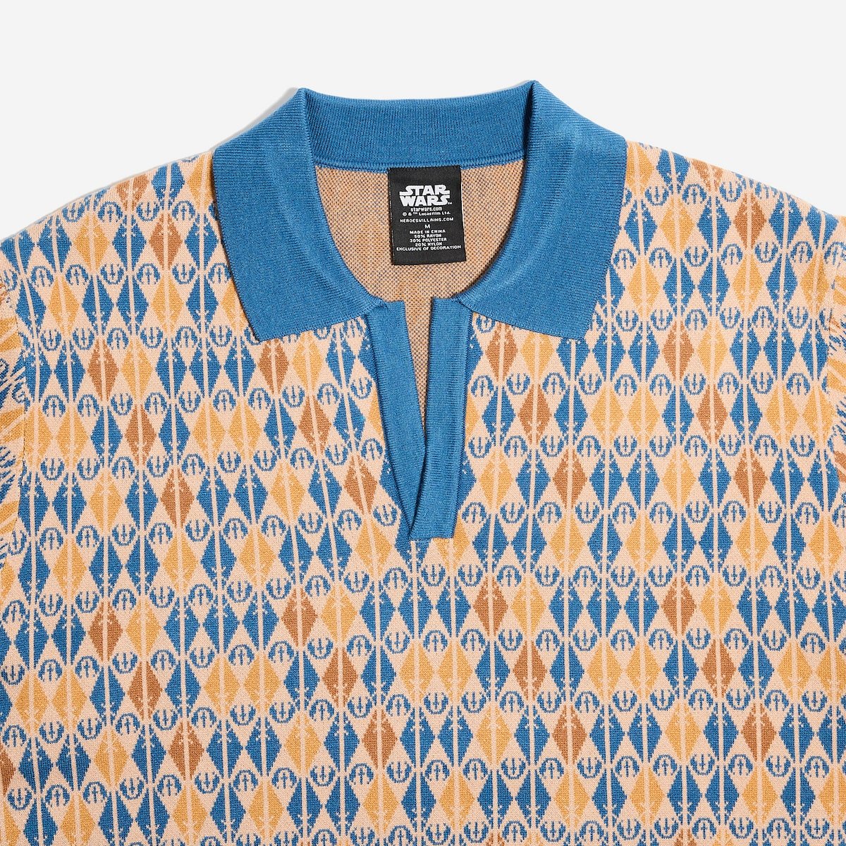 Patterned shirt with blue collar and Star Wars label on a white background