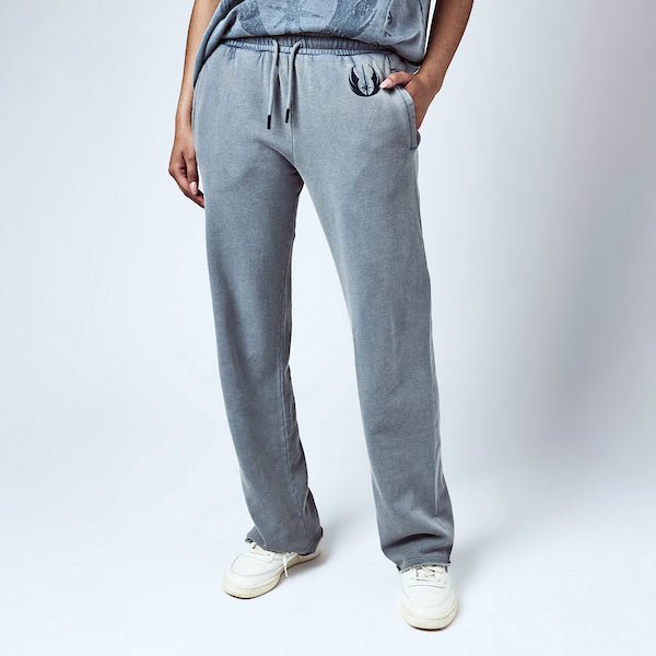 Woman in Light Blue sweatpants with an elastic waistband and black drawstring, featuring a small blue jedi logo near the left pocket and a vertical "jedi knights" graphic printed in distressed blue text along the lower left leg.