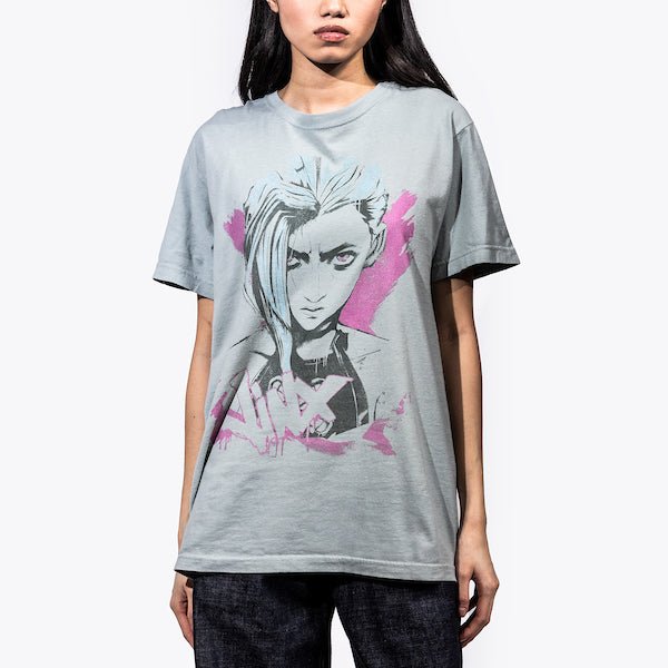 Female Model in a Blue T-Shirt featuring a faded graphic of Jinx from Arcane