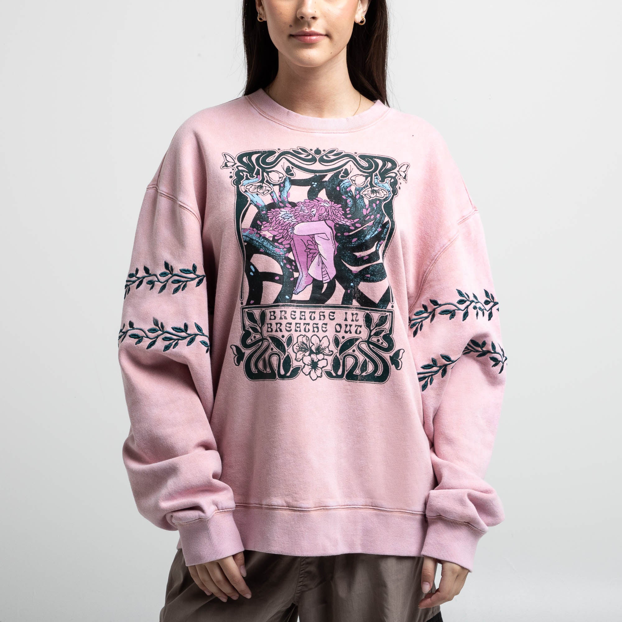 Front view of female modeling Breathe In Breathe Out Blush Crew Sweatshirt.