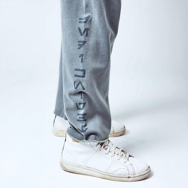 Close up detail of sweatpants. The leg has "Jedi Knights" in blue text down the leg