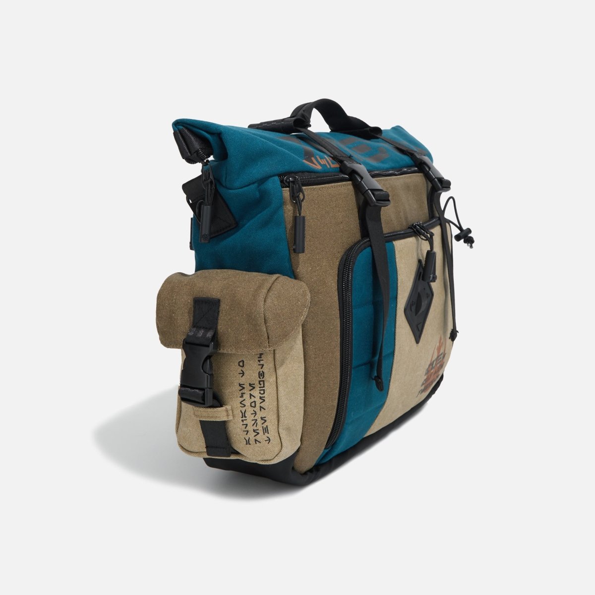 Side view of the buckle clip pocket on the Heroes & Villains Rebel Teal Commuter Bag.