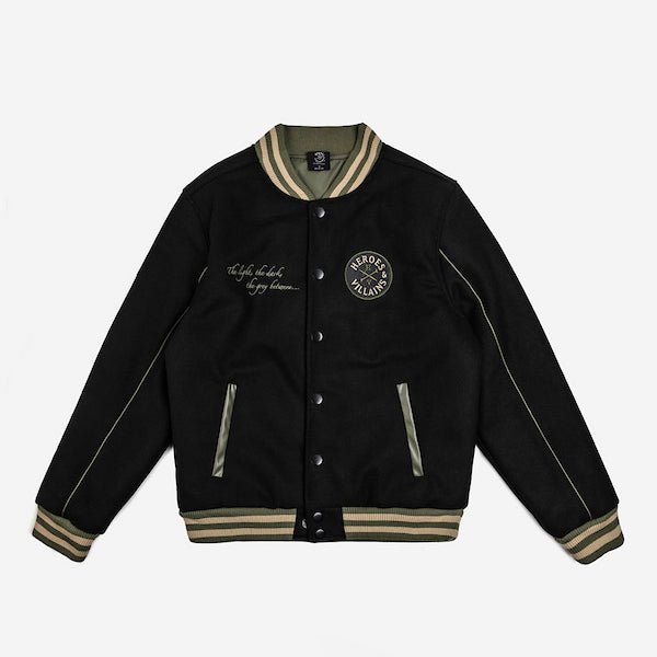 The photo shows a black jacket. The jacket features a green & beige striped cuff on the neckline, the wrists and the hem. The Jacket is a snap button closure. There is 2 pockets, embroidered text on the left chest and a patch on the right patch.