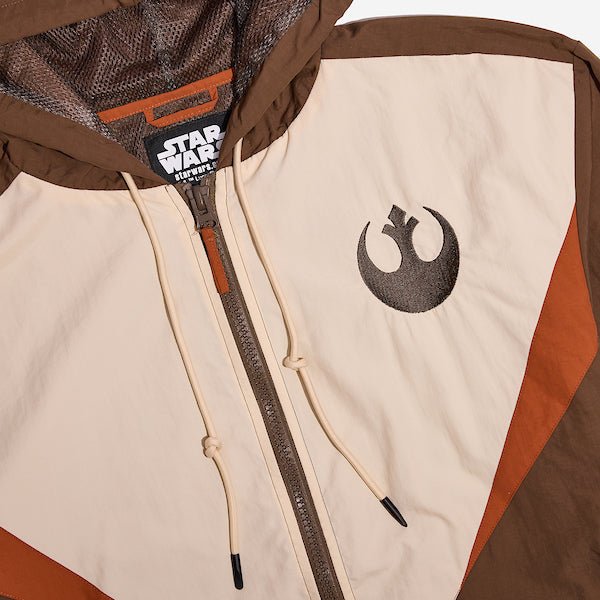 A close up of a Star Wars Rebel themed jacket showing the rebel logo on the front right of the chest.