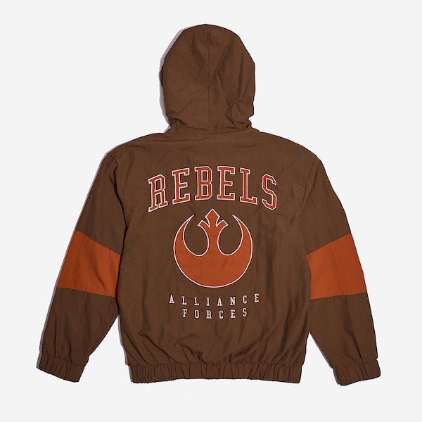 The back of a Star Wars-themed hooded windbreaker jacket, primarily brown with orange accents. The design features large, bold text reading 'REBELS' across the upper back, with the Rebel Alliance emblem in orange below it. Beneath the emblem, the words 'ALLIANCE FORCES' are printed in a smaller font. The jacket has an elastic waistband and cuffs, with a color-blocked pattern matching the front design.