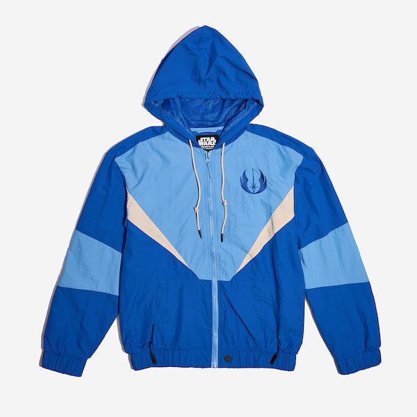 A Star Wars-themed hooded windbreaker jacket featuring a Jedi Knights emblem on the left chest. The jacket has a color-blocked design in Blue, Light Blue and White, with a front zipper, adjustable drawstrings on the hood, elastic cuffs, and two zippered pockets.