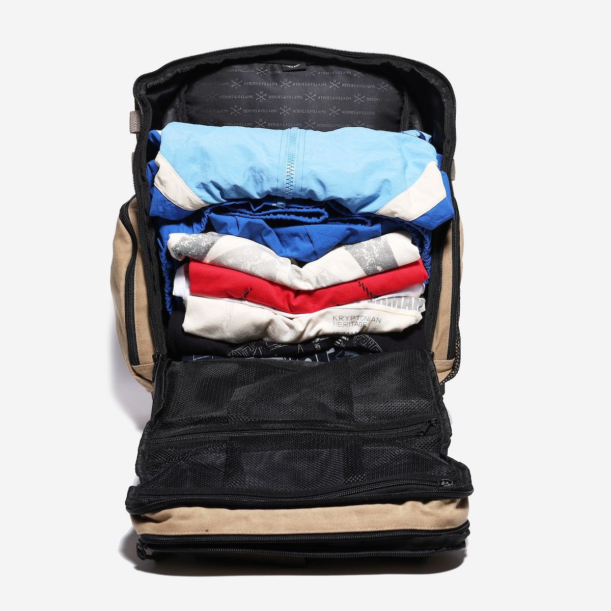 Backpack with clothes packed inside on a white background