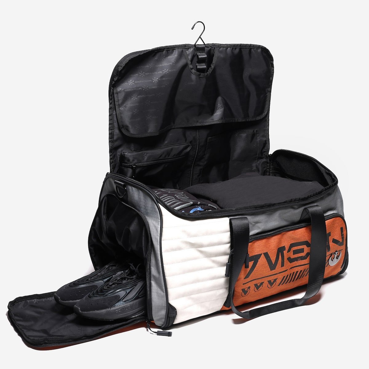 Open travel bag with a shoe compartment on a white background