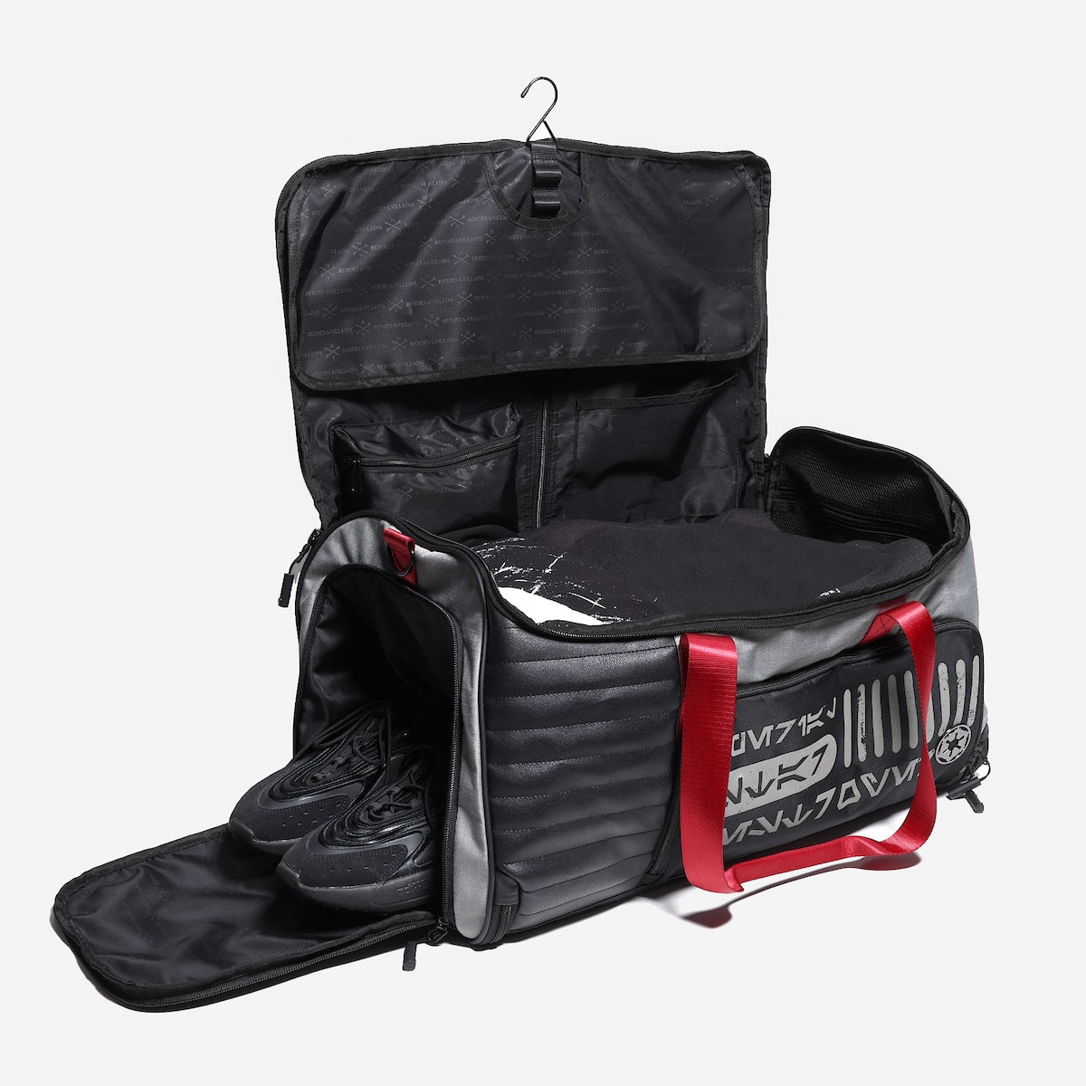 Black travel bag with a shoe compartment on a white background