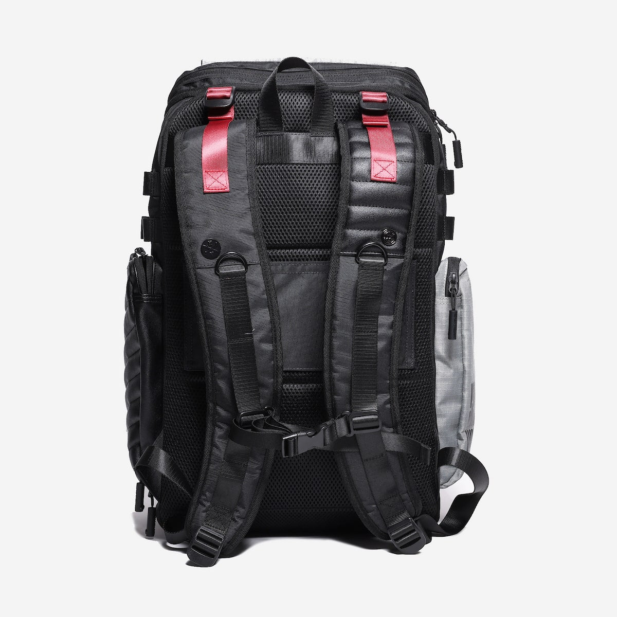 Back side of a travel backpack showing shoulder straps and luggage strap detail