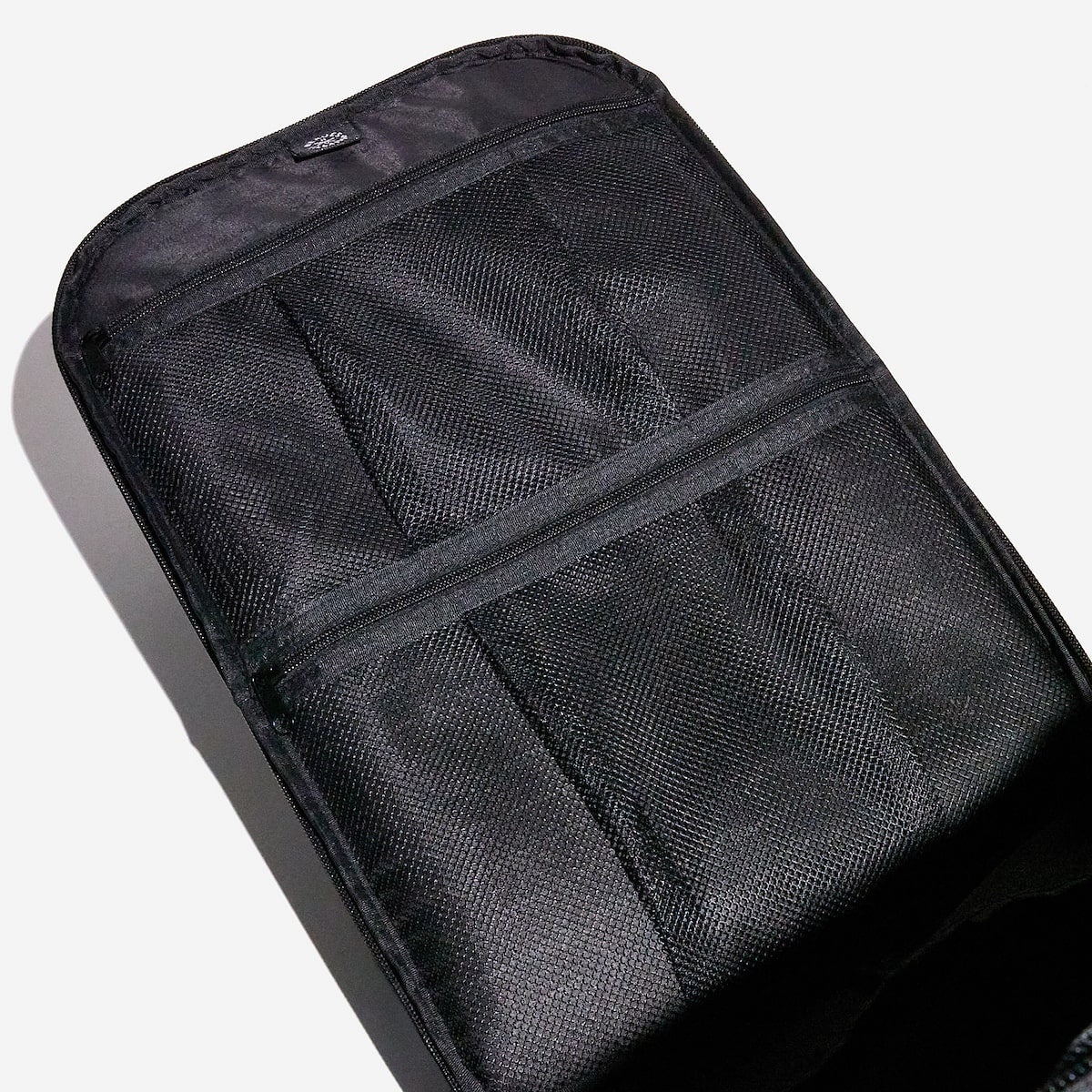 Organizational mesh pockets inside a backpack