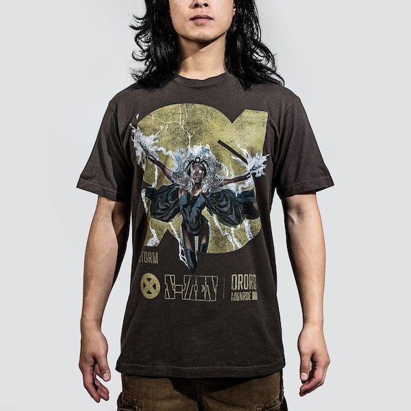 Man in a brown tee featuring a faded graphic of Storm from X-Men