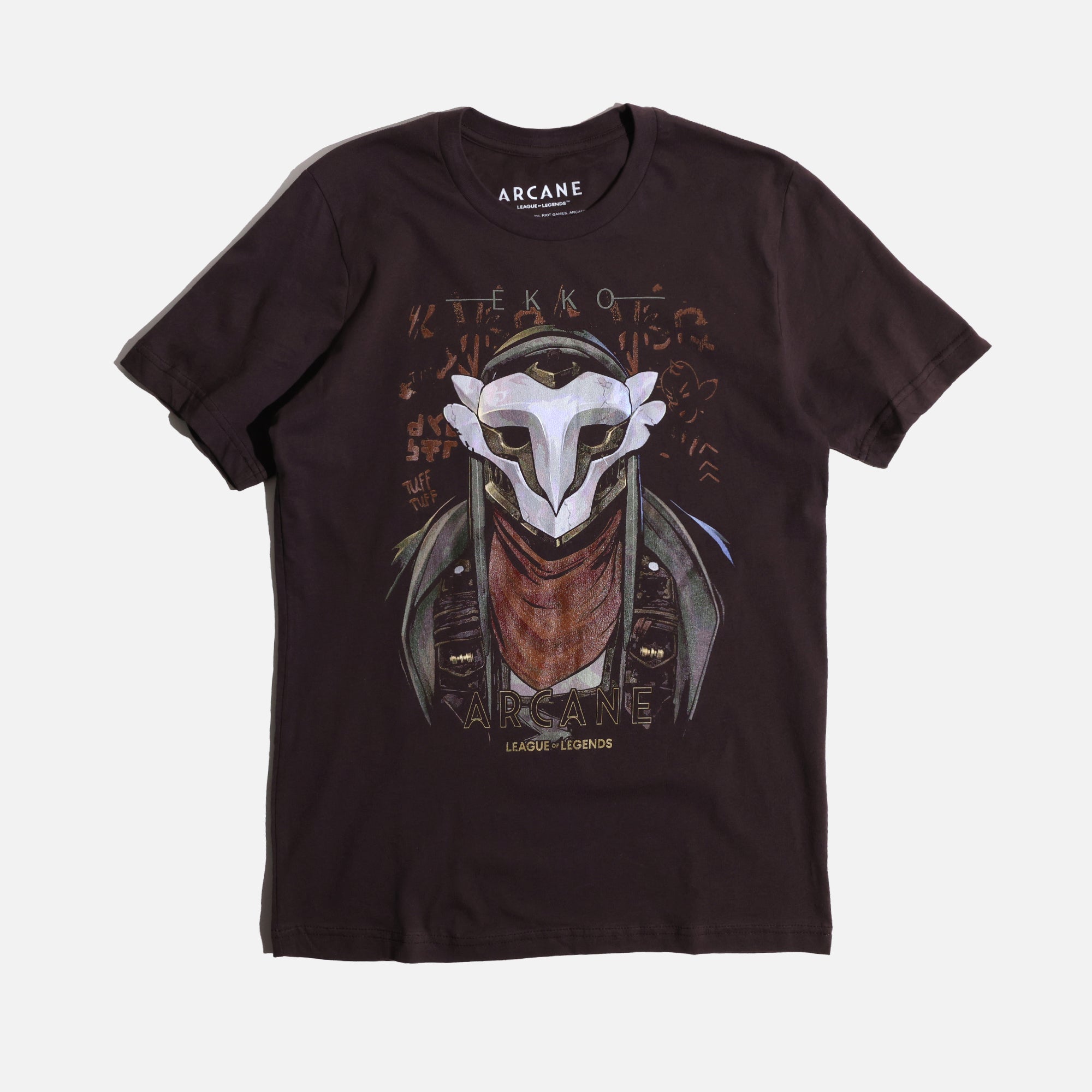 A brown Arcane x League of Legends t-shirt featuring Ekko wearing his signature mask and red scarf. The design includes stylized graffiti-like text, with ‘Ekko’ at the top and ‘Arcane’ and ‘League of Legends’ at the bottom in a bold font. The artwork has a gritty, cyberpunk aesthetic with metallic and distressed details