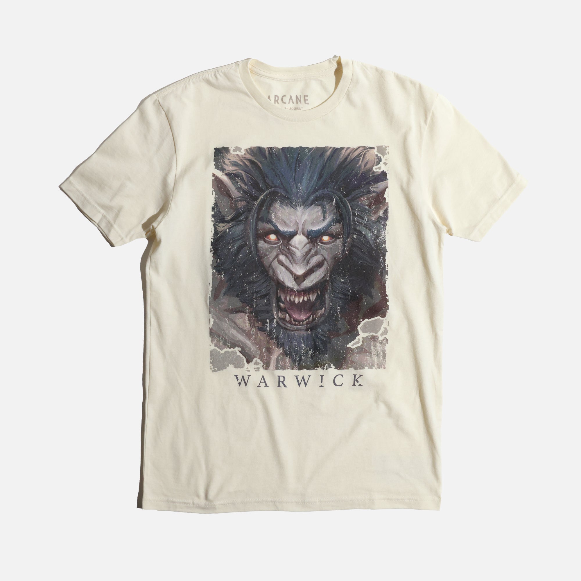 A cream-colored League of Legends t-shirt featuring a detailed illustration of Warwick. The design showcases his snarling, beastly face with glowing orange eyes, sharp fangs, and dark fur. The artwork has a distressed, grunge-style border, giving it a raw and intense look. 'Warwick' is printed in bold, stylized lettering below the image
