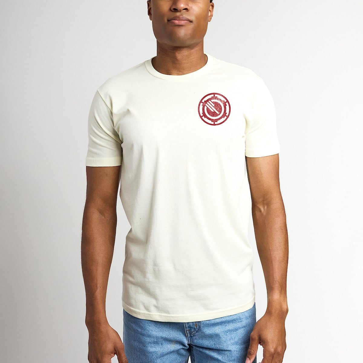 Man wearing a white t-shirt with a red Star Wars Inferno Squad logo on a plain background