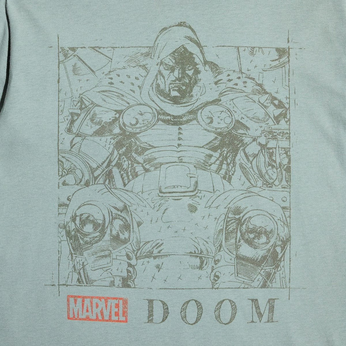 T-shirt with a graphic of a character in armor and 'Marvel Doom' text on a light green background
