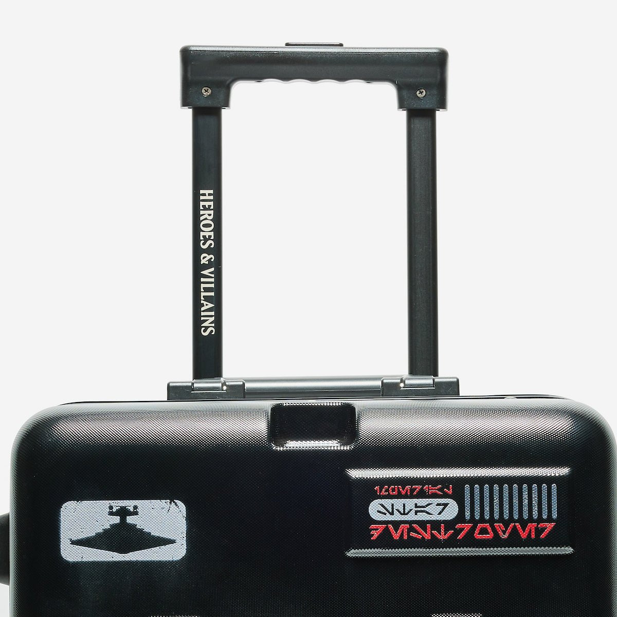 Black suitcase with 'Heroes & Villains' and 'Star Wars' branding on a white background