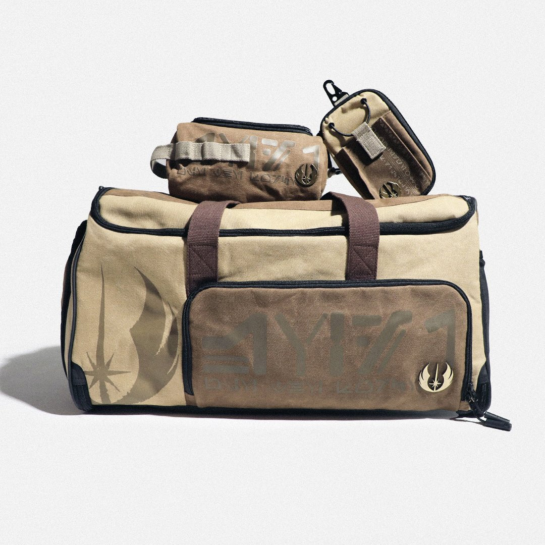 Beige and brown Jedi duffel bag with smaller pouches on a light gray background