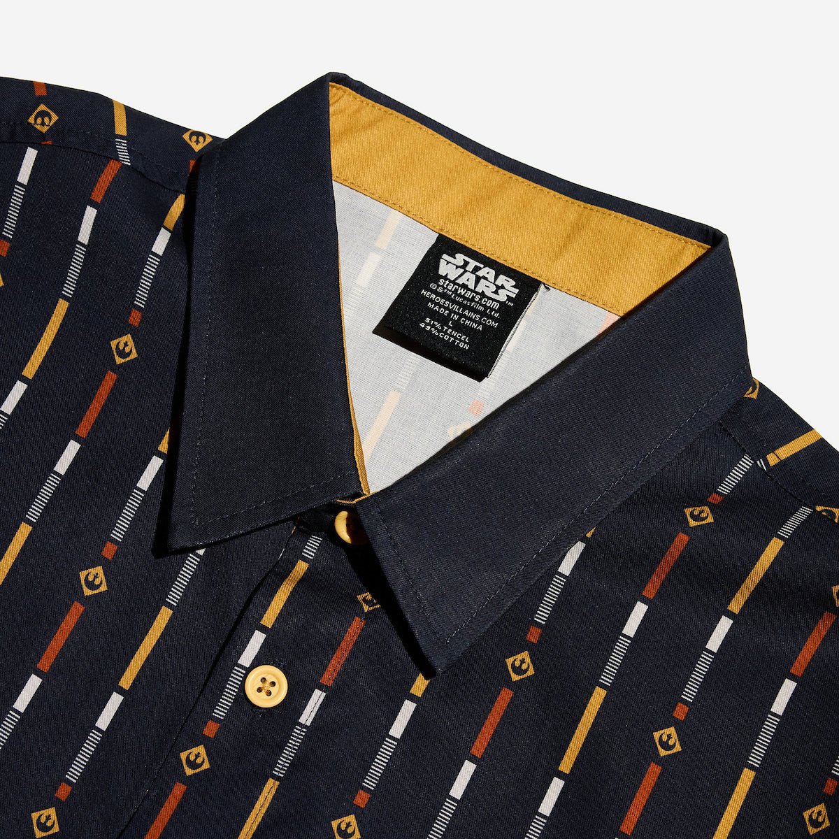 A close up navy shirt with a star wars rebel motif in a striped pattern