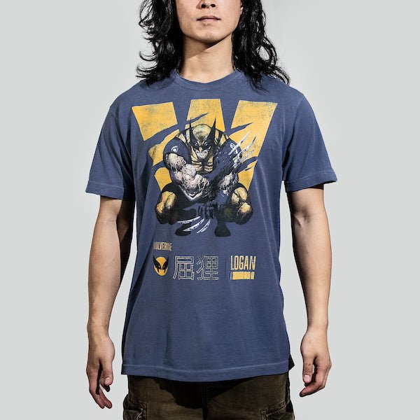 Man in a blue t-shirt featuring a faded graphic of Wolverine from X-Men