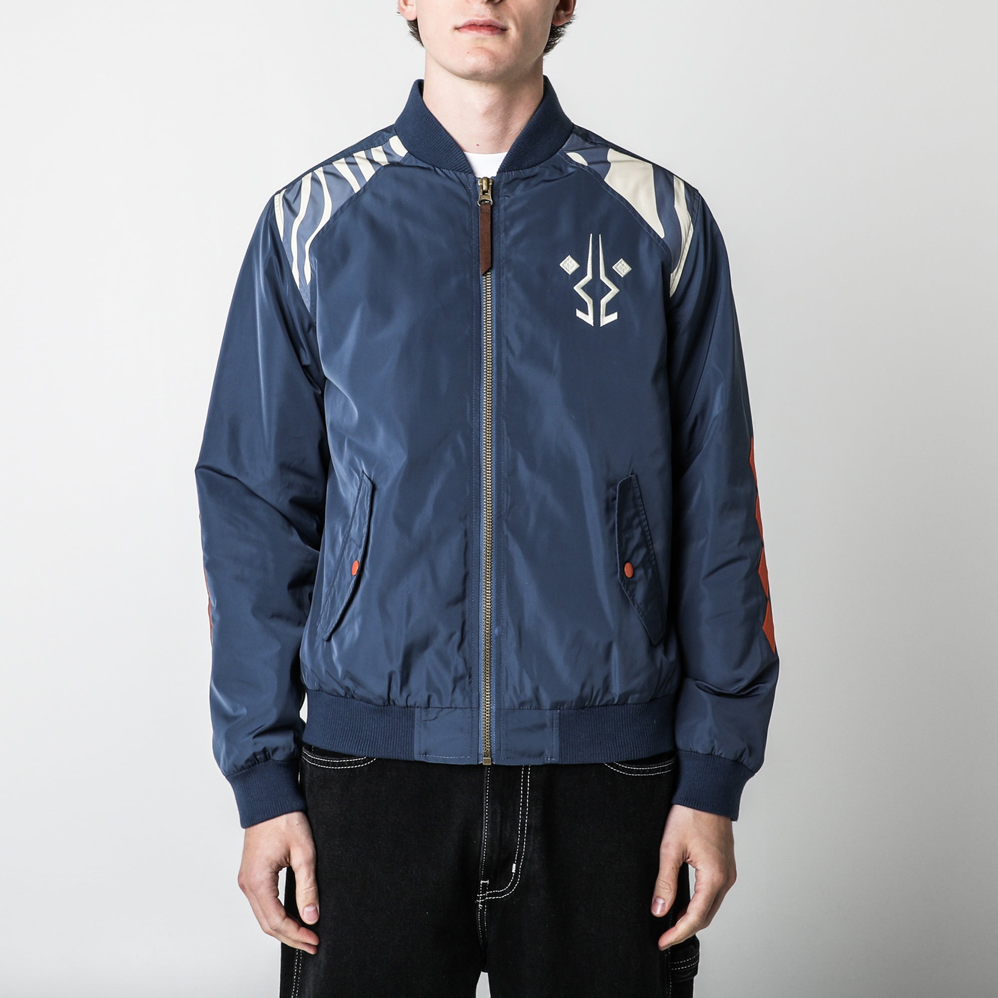 Ahsoka Bomber Jacket with embroidered emblem, zip front, flap pockets, ribbed collar, cuffs, and hem in navy blue.