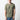Man in a green T-shirt with a dark blue abstract sunburst design and text in the bottom right corner.