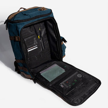 Open blue backpack with compartments on a white background