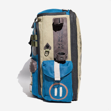 Multicolored Star Wars backpack with multiple pockets and straps for a light saber on a white background