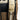 Close-up of a brown backpack strap with a Jedi logo and visible text in the Star Wars language Aurebesh reading "The Force" on a white background