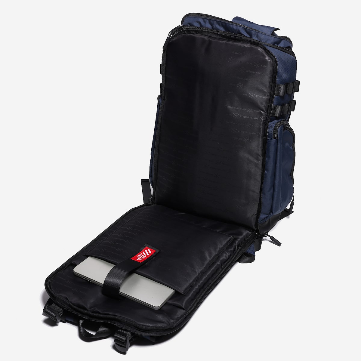 Black backpack with a laptop sleeve with a red label on a white background