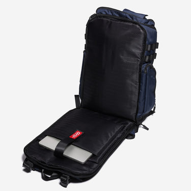Black backpack with a laptop sleeve with a red label on a white background