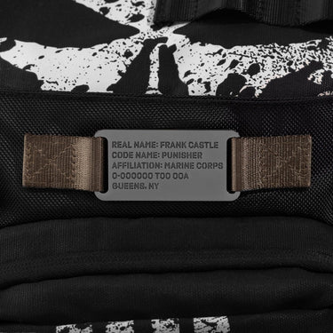 Black and white patterned bag with a military style dog tag reading "Real Name: Frank Castle Code Name: Punisher Affiliation: Marine Corps"  on a brown strap