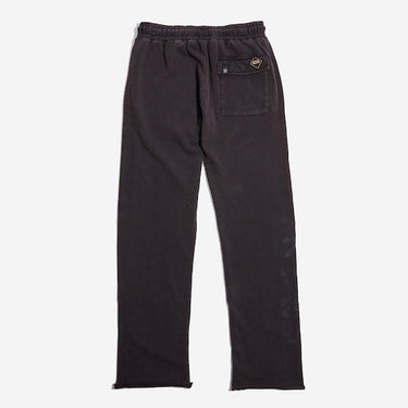 The back of black sweatpants with an elastic waistband, featuring a back pocket with button closure and a vertical "Empire" graphic printed in distressed black text along the lower left leg.