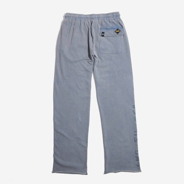 The back of blue sweatpants with an elastic waistband, featuring a back pocket with button closure and a vertical "Jedi Knights" graphic printed in distressed black text along the lower left leg.